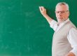 Teacher in front of chalkboard