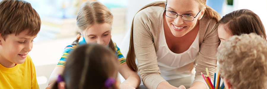 Smiling teacher with kids