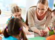 Kids are playing with their teacher