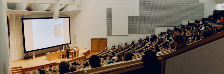 students in classroom listening lecture