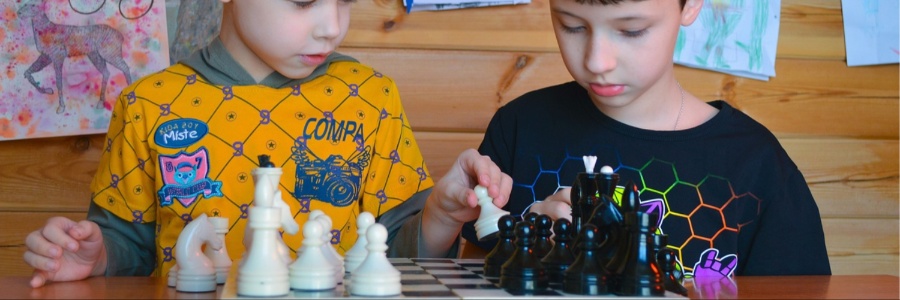 Two boys playing chess