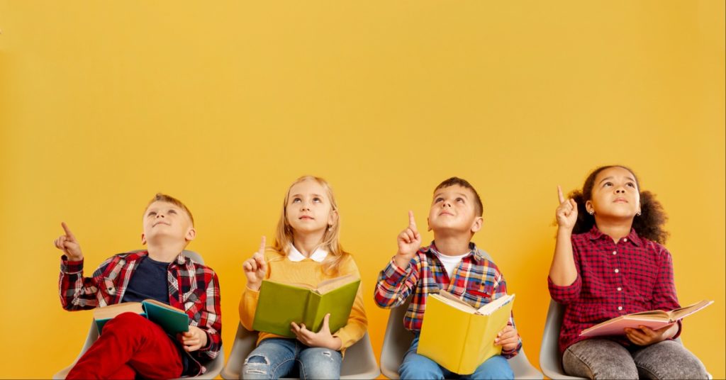 School kids holding books