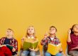 School kids holding books